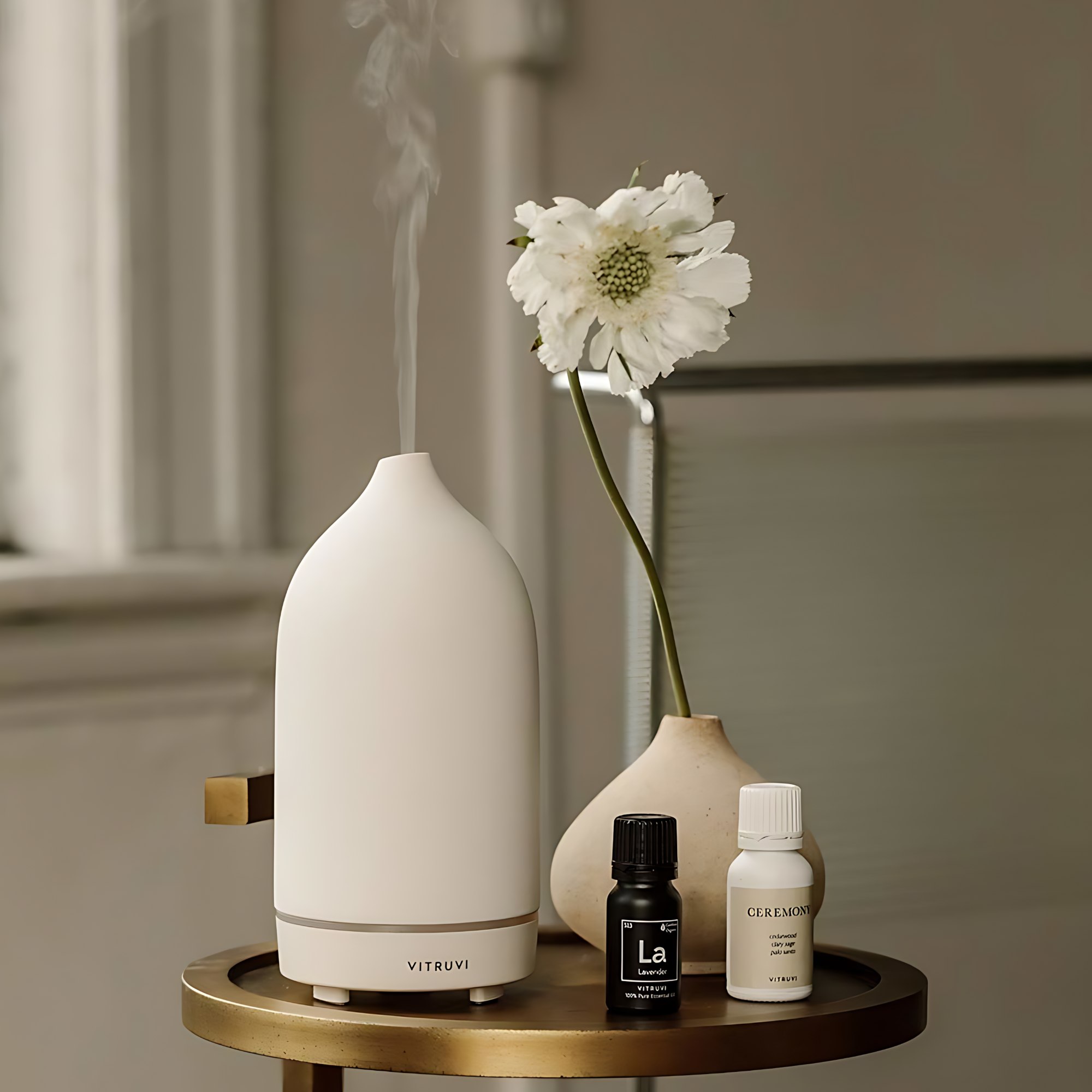 Sleek white ultrasonic oil diffuser in a modern living space